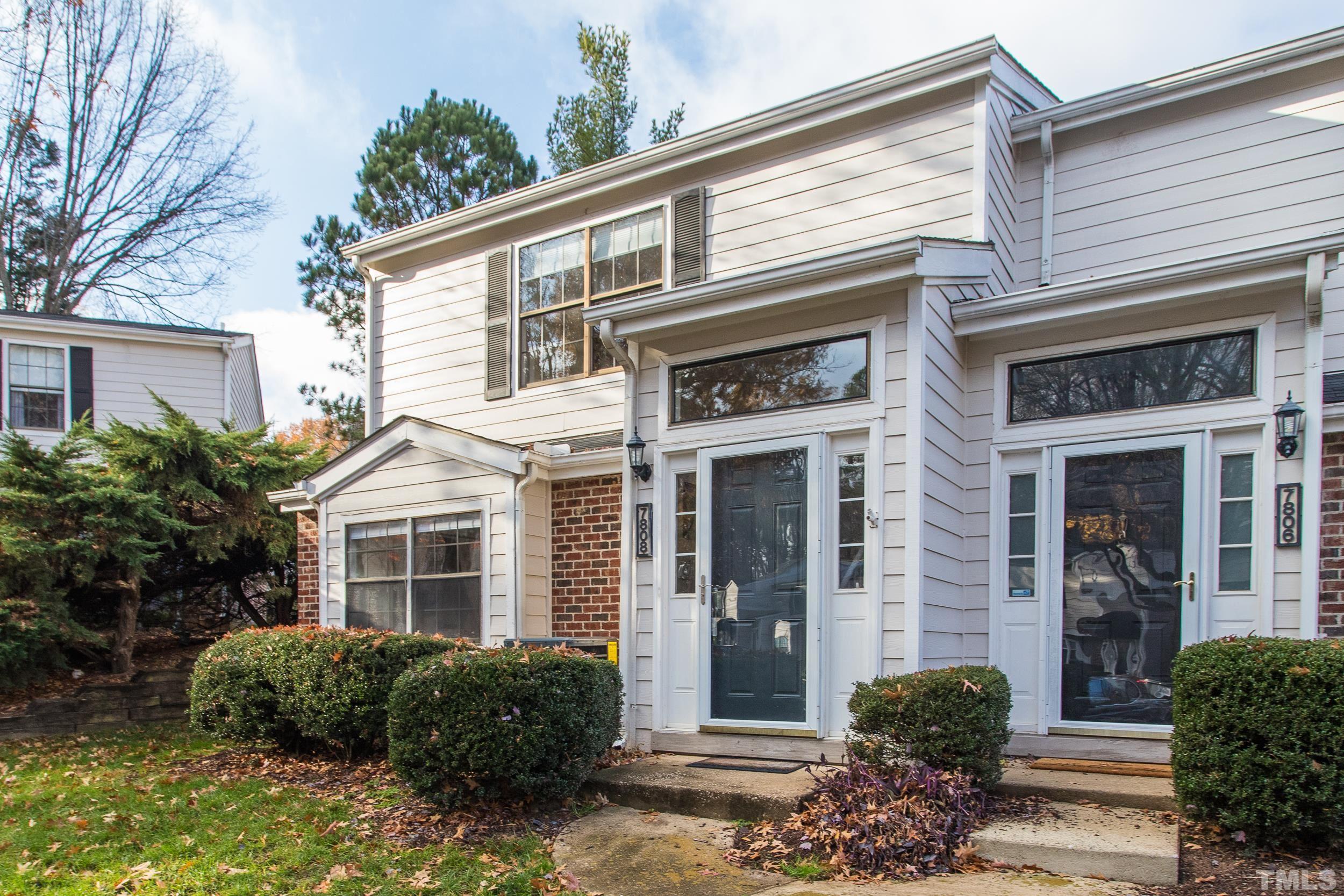 7808 Falcon Rest Circle Raleigh, NC 27615 - Photo 27 of 28 a front view of a house with garden