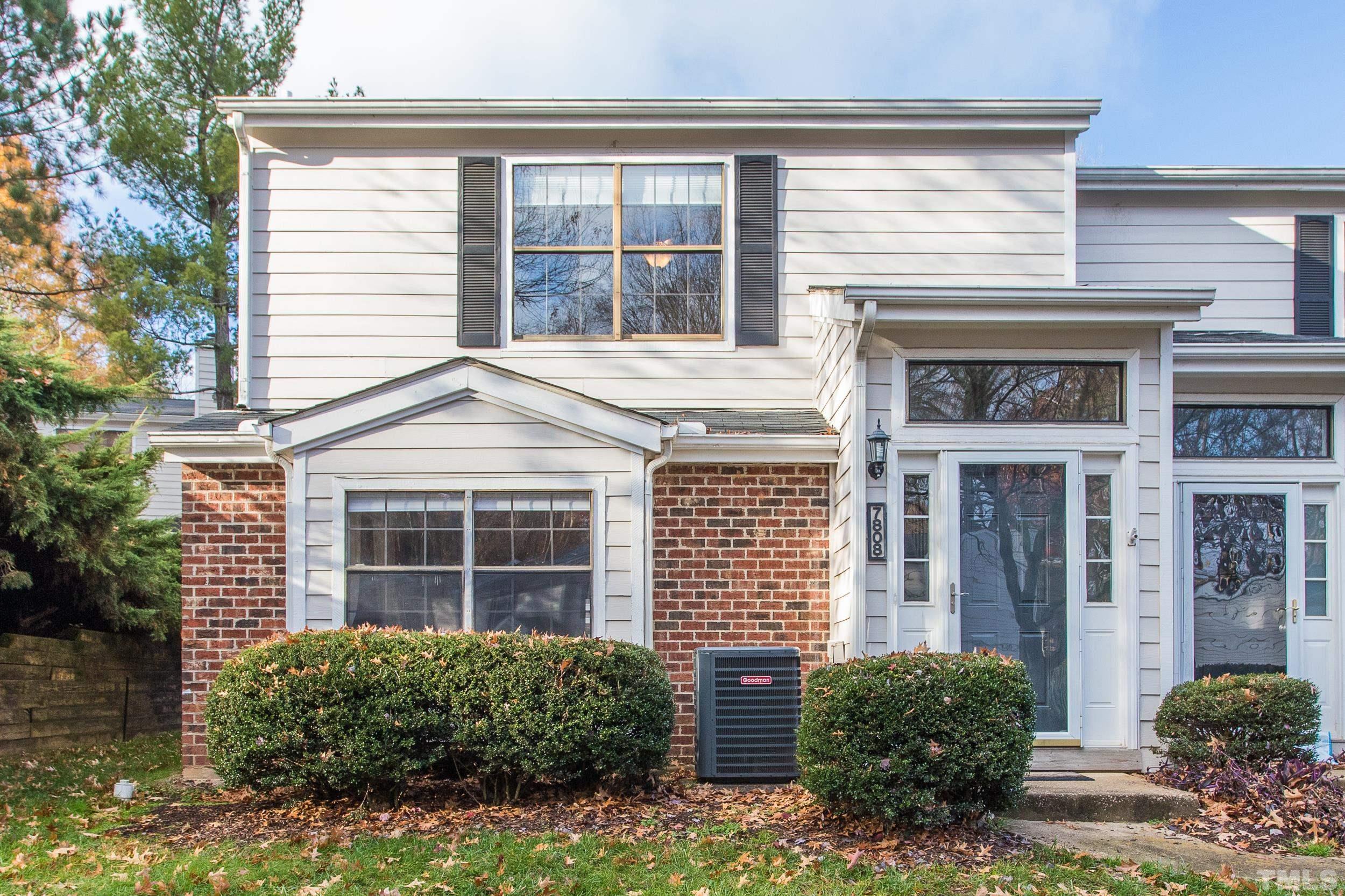 7808 Falcon Rest Circle Raleigh, NC 27615 - Photo 28 of 28 a view of a house with potted plants and a large window