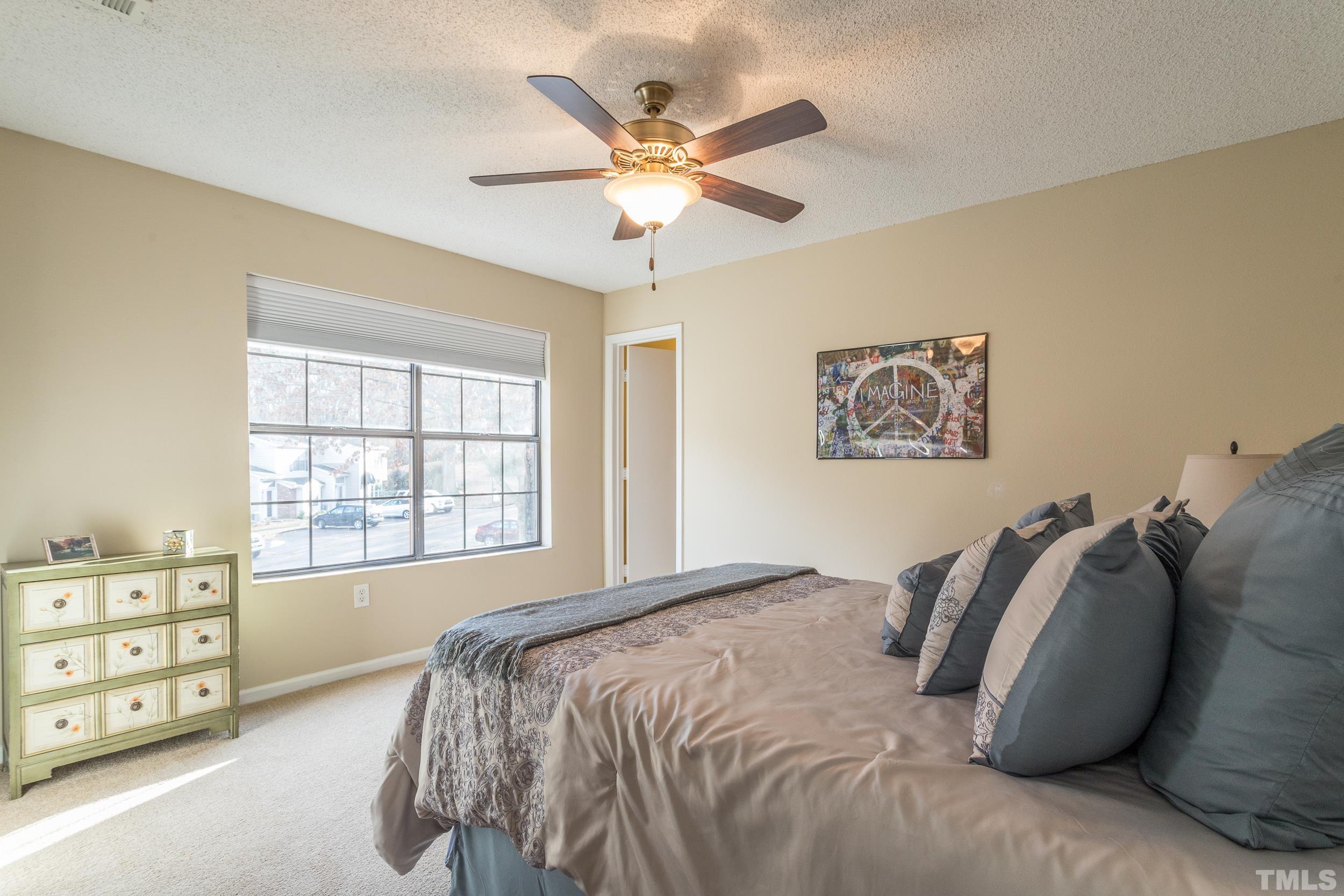 7808 Falcon Rest Circle Raleigh, NC 27615 - Photo 5 of 28 a bedroom with a bed and a closet