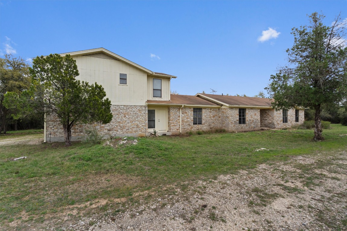 422 Patricia Road Georgetown, TX 78628 - Photo 11 of 14 a view of a yard in front of a house with a large tree