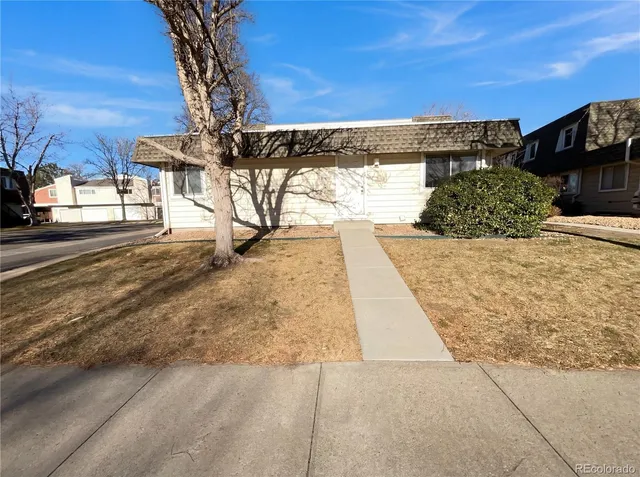 a view of a street with a building in the background