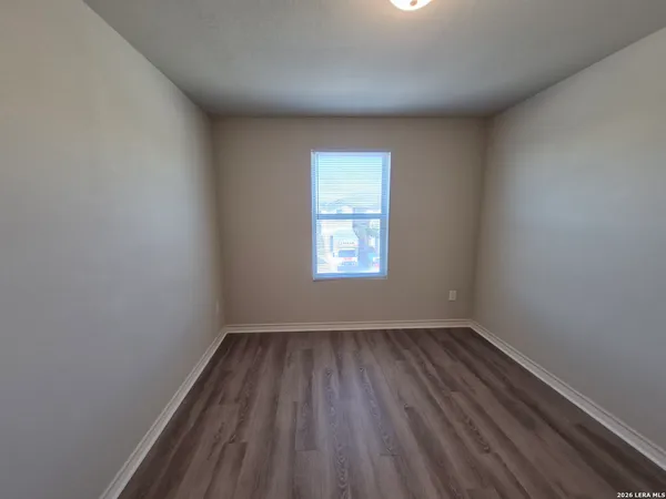 a white toilet sitting next to a bath tub