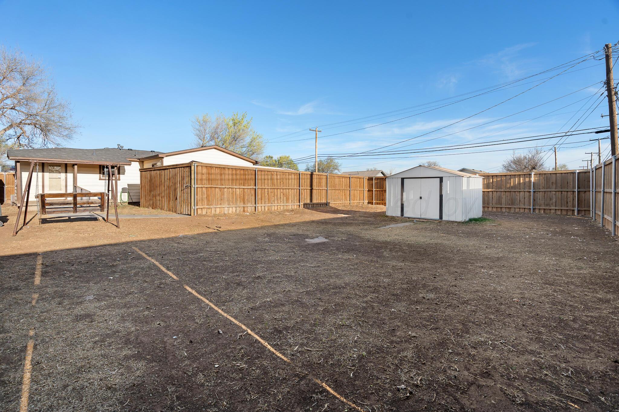 710 North Roberts Street Amarillo, TX 79107 - Photo 16 of 20 a view of a house with a yard and garage