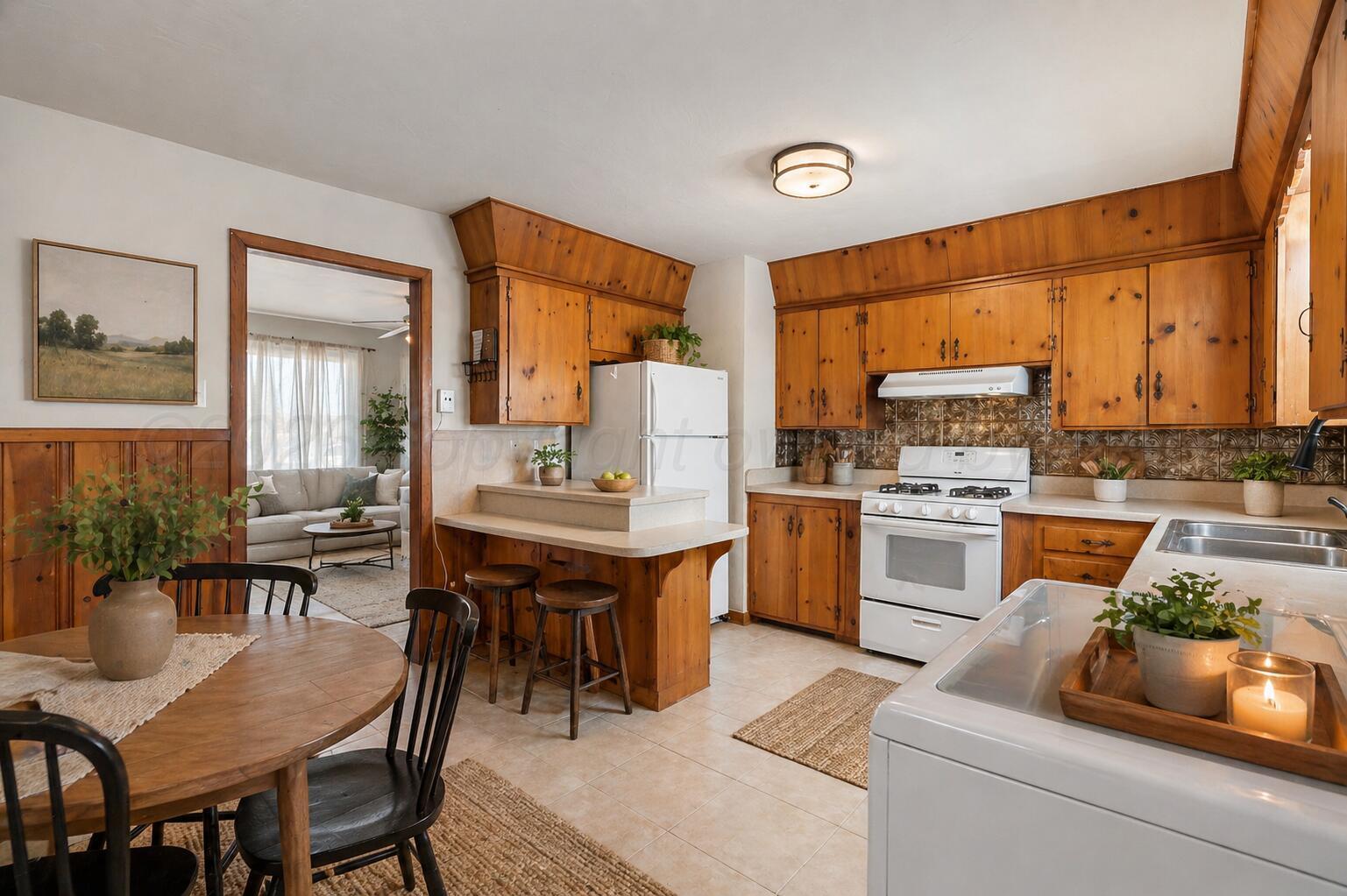 710 North Roberts Street Amarillo, TX 79107 - Photo 6 of 20 a kitchen with a table chairs sink and cabinets