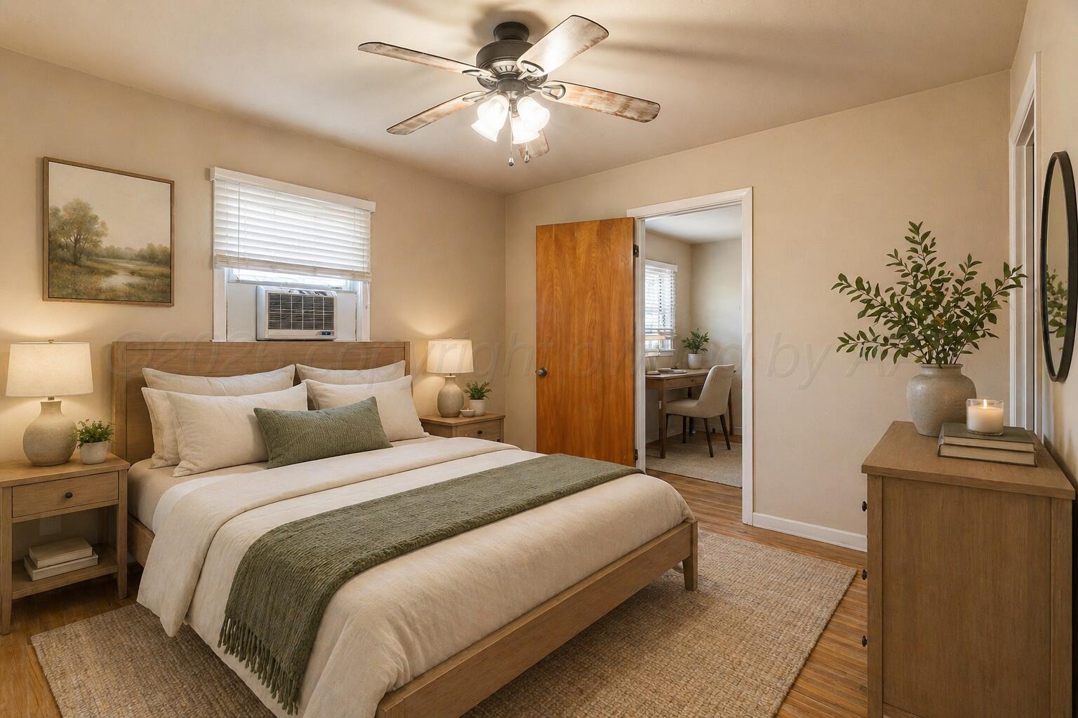 710 North Roberts Street Amarillo, TX 79107 - Photo 8 of 20 a bedroom with a bed and a chandelier