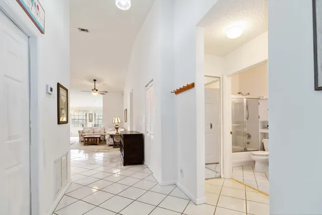 a view of kitchen with furniture and refrigerator