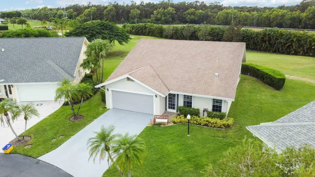 a aerial view of a house with a yard