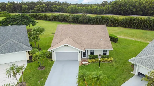 an aerial view of a house having yard