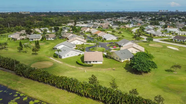 an aerial view of a house with a ocean view