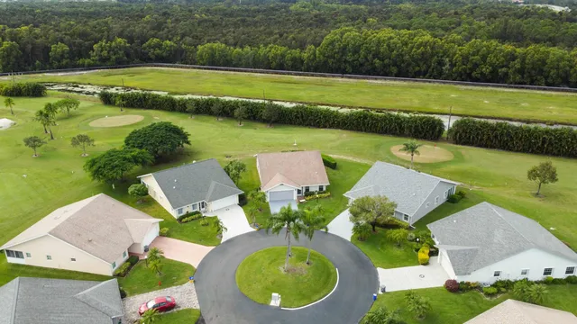 a view of a livingroom with furniture and staircase