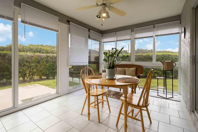a view of a dining room with furniture window and outside view