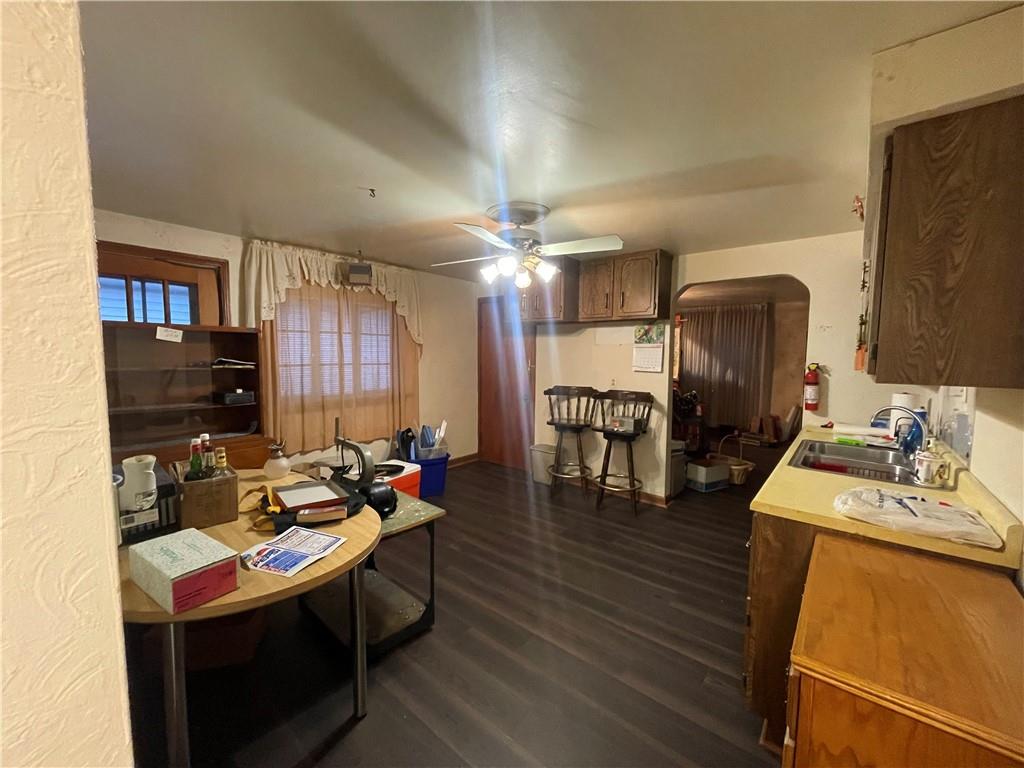 417 North 6th Avenue Butler, PA 16001 - Photo 11 of 25 a kitchen with sink refrigerator dining table and chairs
