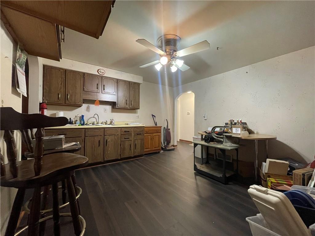 417 North 6th Avenue Butler, PA 16001 - Photo 12 of 25 a kitchen with stainless steel appliances kitchen island granite countertop a stove a sink and a refrigerator