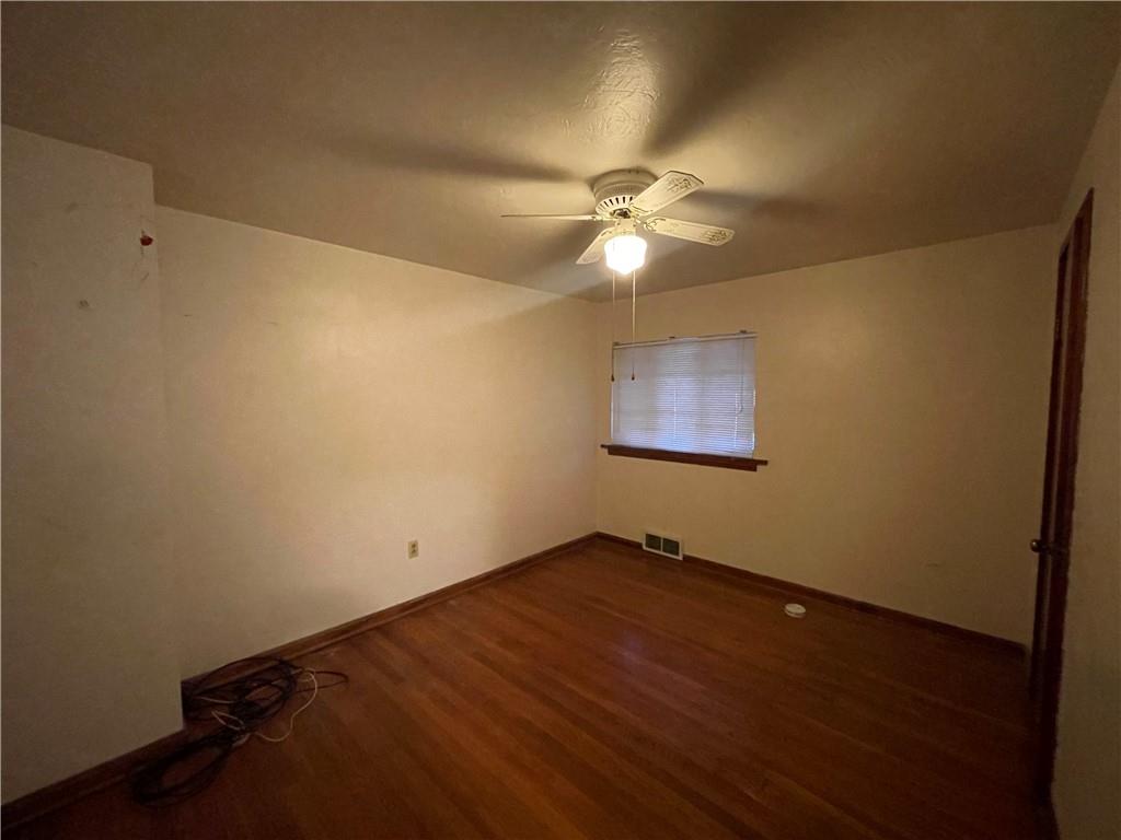 417 North 6th Avenue Butler, PA 16001 - Photo 14 of 25 an empty room with a fan & a ceiling fan
