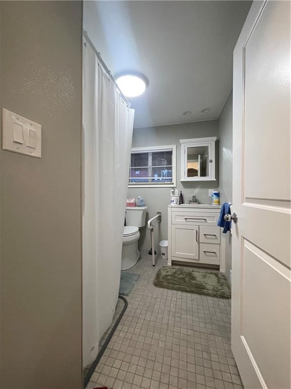 417 North 6th Avenue Butler, PA 16001 - Photo 17 of 25 a living room with furniture a clock and a view of kitchen