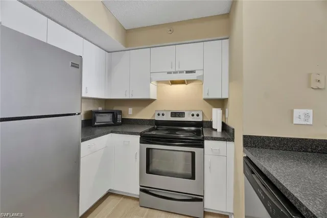 a kitchen with a stove and a sink
