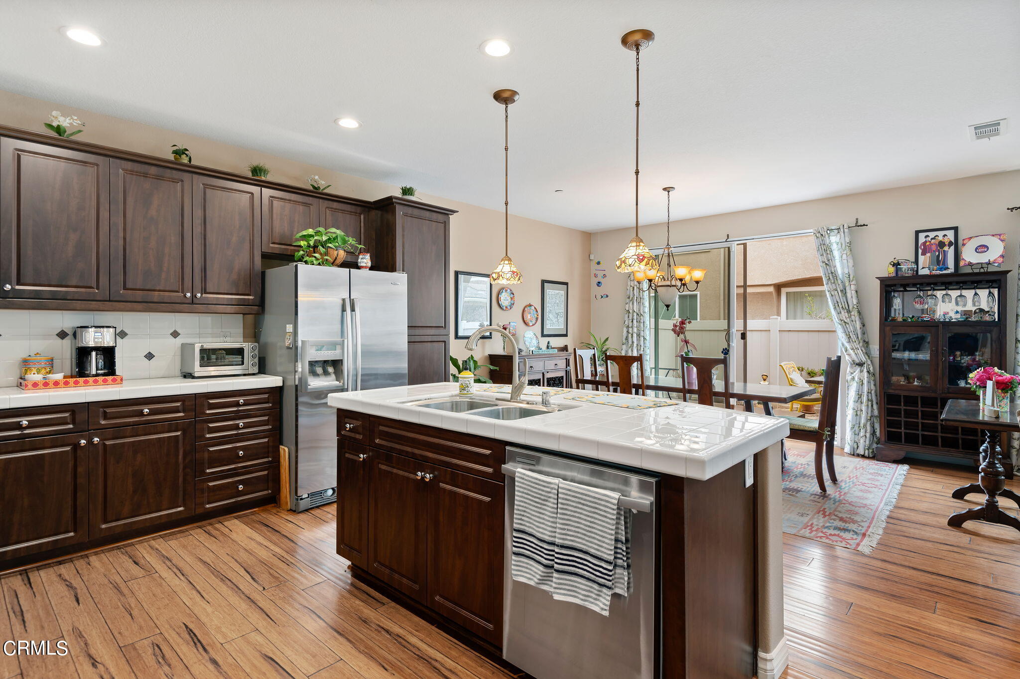 3630 Jolly Roger Way Oxnard, CA 93035 - Photo 11 of 24 a kitchen with kitchen island granite countertop a sink appliances and cabinets