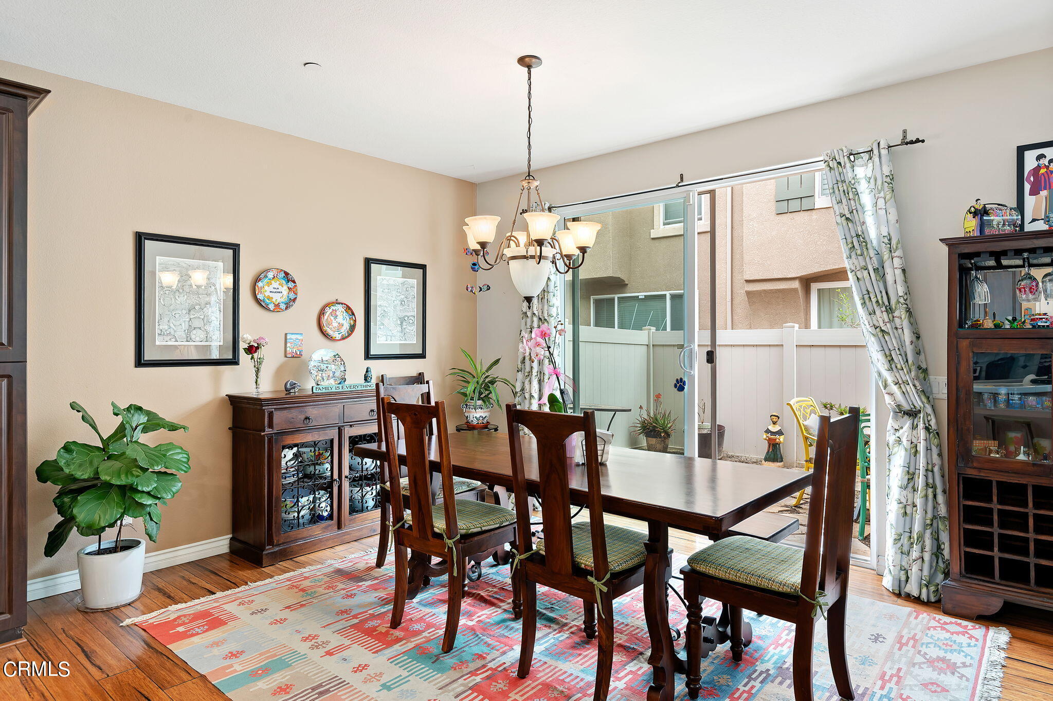 3630 Jolly Roger Way Oxnard, CA 93035 - Photo 8 of 24 a dining room with furniture potted plants and wooden floor