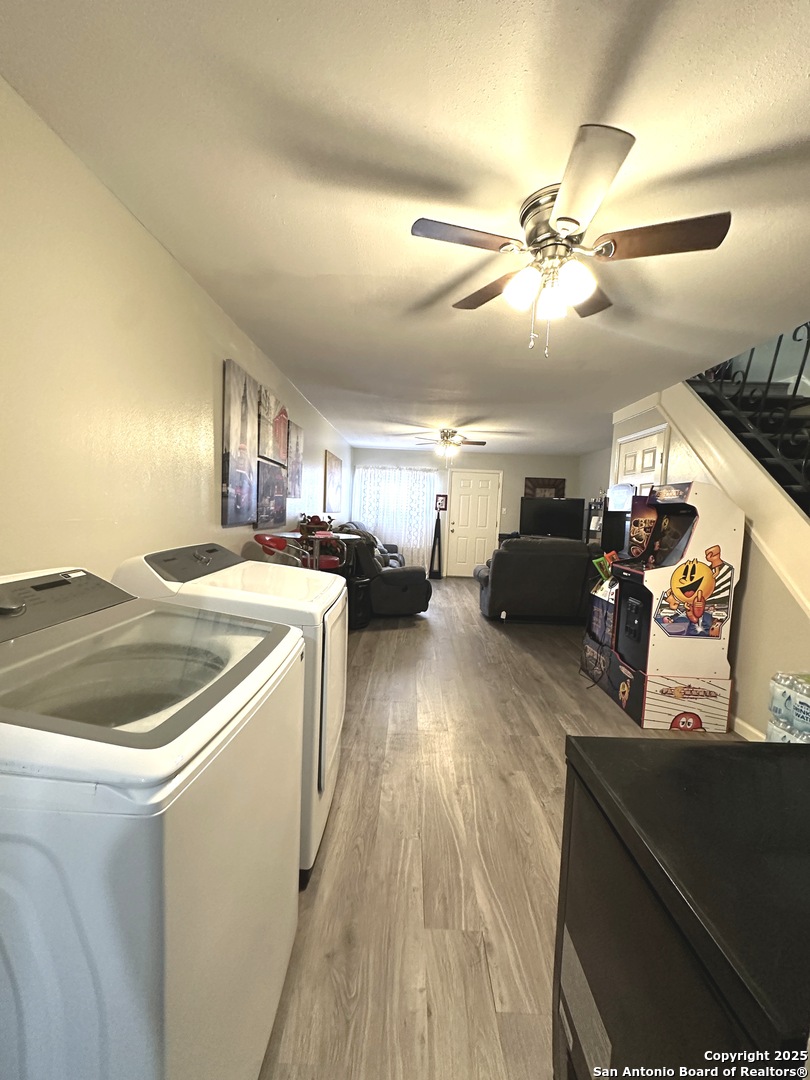 911 Vance Jackson Road, Unit Y San Antonio, TX 78201 - Photo 11 of 40 a view of a livingroom with furniture a ceiling fan and wooden floor