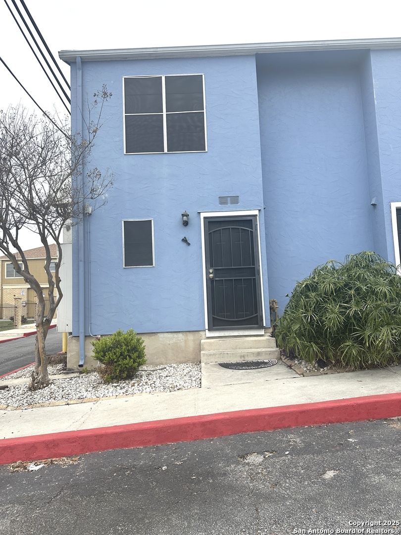 911 Vance Jackson Road, Unit Y San Antonio, TX 78201 - Photo 2 of 40 a house with trees in front of it