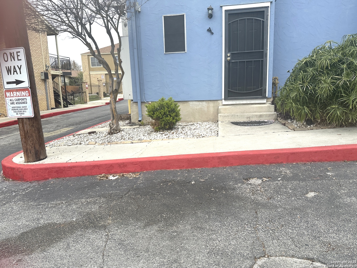 911 Vance Jackson Road, Unit Y San Antonio, TX 78201 - Photo 4 of 40 a view of a small house with a yard