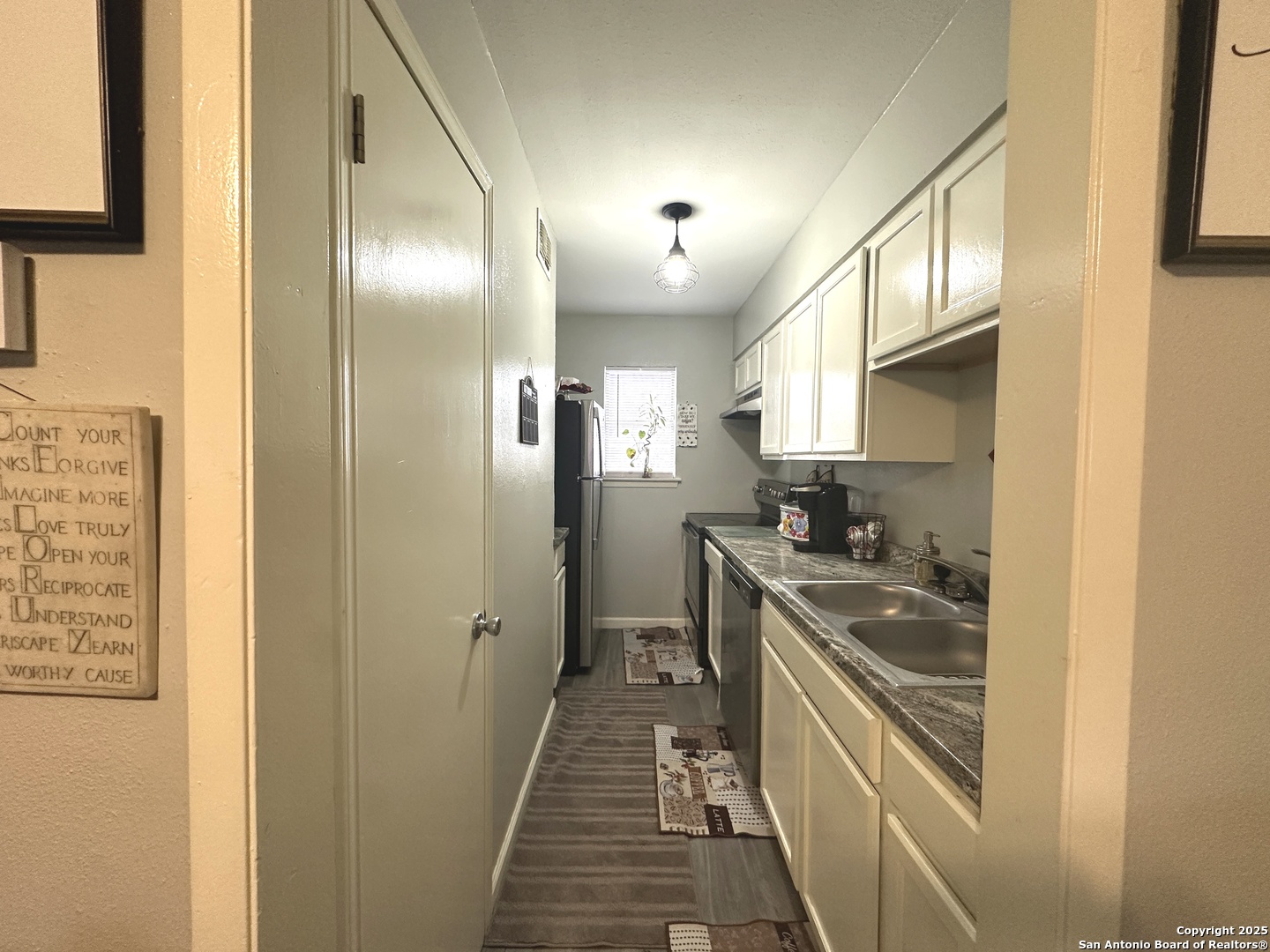 911 Vance Jackson Road, Unit Y San Antonio, TX 78201 - Photo 8 of 40 a kitchen with stainless steel appliances granite countertop a refrigerator a stove and a sink