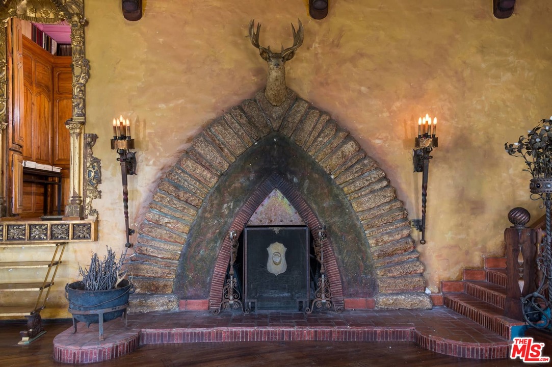 17520 Revello Drive Pacific Palisades, CA 90272 - Photo 13 of 51 a living room with furniture and a fireplace