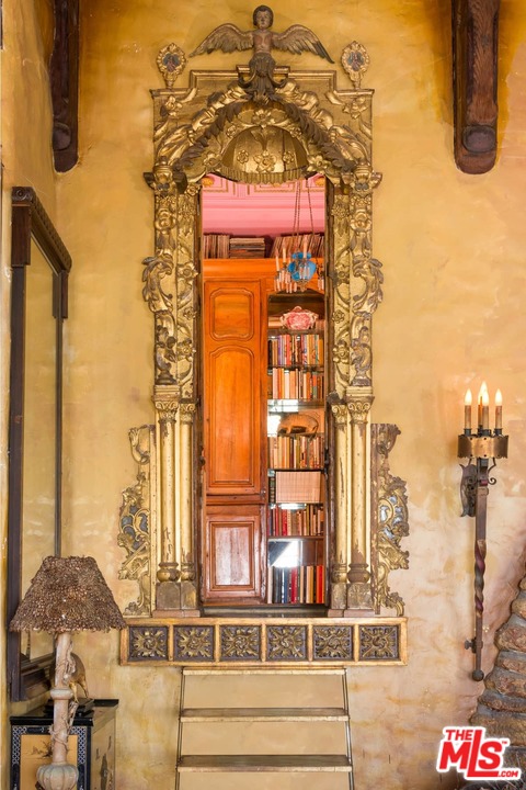 17520 Revello Drive Pacific Palisades, CA 90272 - Photo 15 of 51 a front view of a building with glass windows and door