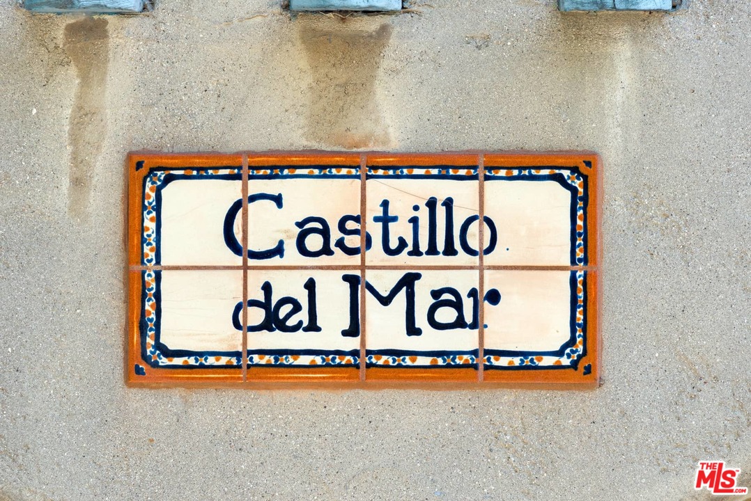 17520 Revello Drive Pacific Palisades, CA 90272 - Photo 2 of 51 a signage on a wall next to a wall