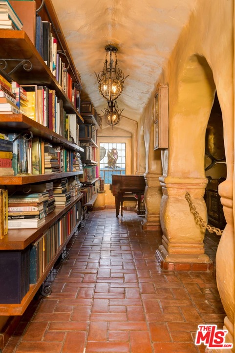 17520 Revello Drive Pacific Palisades, CA 90272 - Photo 21 of 51 a view of a swimming pool with a lounge chair