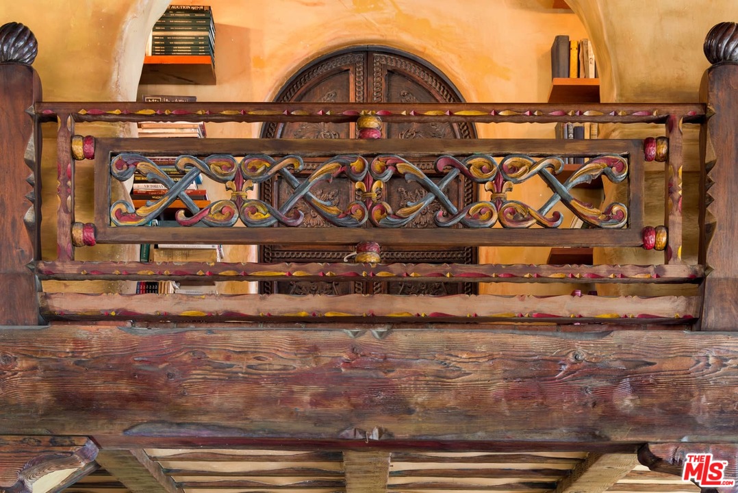 17520 Revello Drive Pacific Palisades, CA 90272 - Photo 28 of 51 a view of a street with an entrance and parked