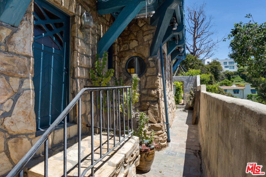 17520 Revello Drive Pacific Palisades, CA 90272 - Photo 35 of 51 a view of balcony with wooden floor and fence