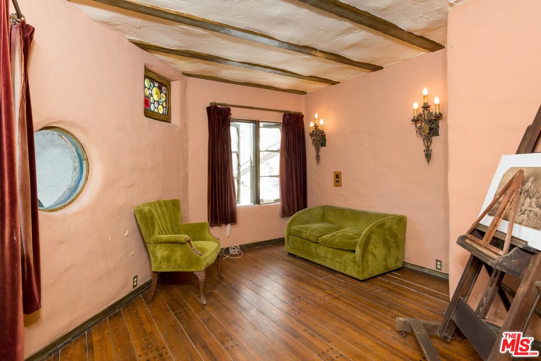 17520 Revello Drive Pacific Palisades, CA 90272 - Photo 38 of 51 a living room with furniture and a fireplace