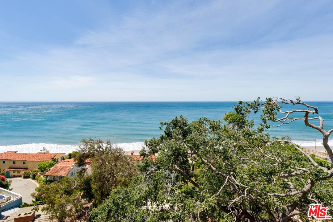 17520 Revello Drive Pacific Palisades, CA 90272 - Photo 45 of 51 a view of a lake with a mountain