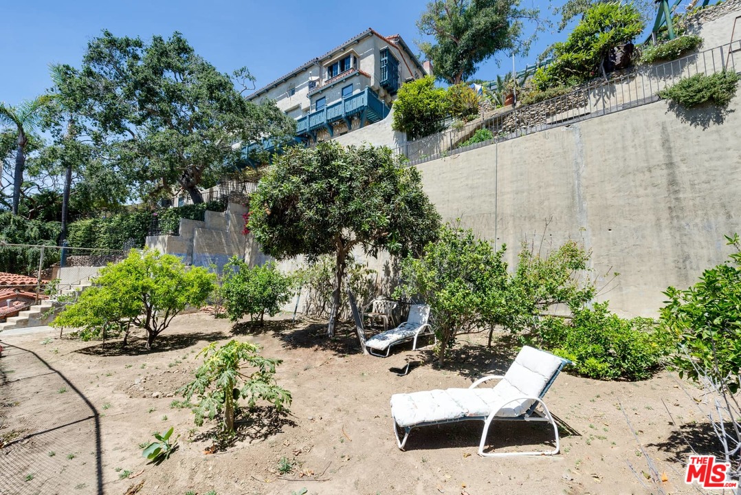 17520 Revello Drive Pacific Palisades, CA 90272 - Photo 46 of 51 a view of a backyard with sitting area