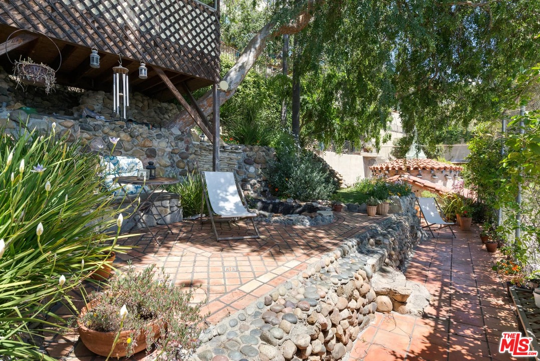 17520 Revello Drive Pacific Palisades, CA 90272 - Photo 50 of 51 a view of a house with a tree