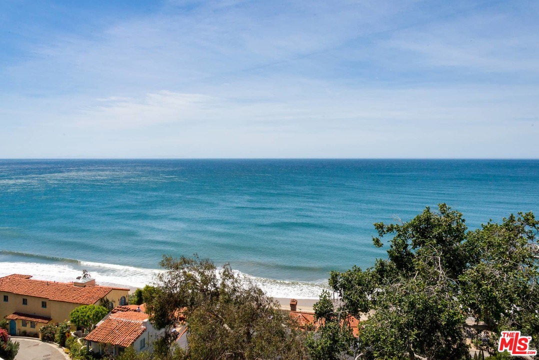 17520 Revello Drive Pacific Palisades, CA 90272 - Photo 5 of 51 a view of a lake with a mountain
