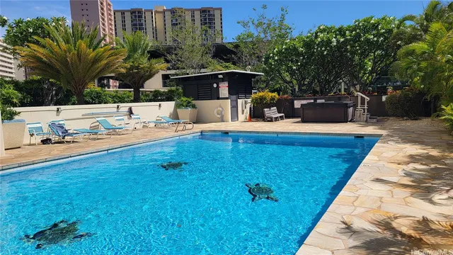 a view of a backyard with sitting area