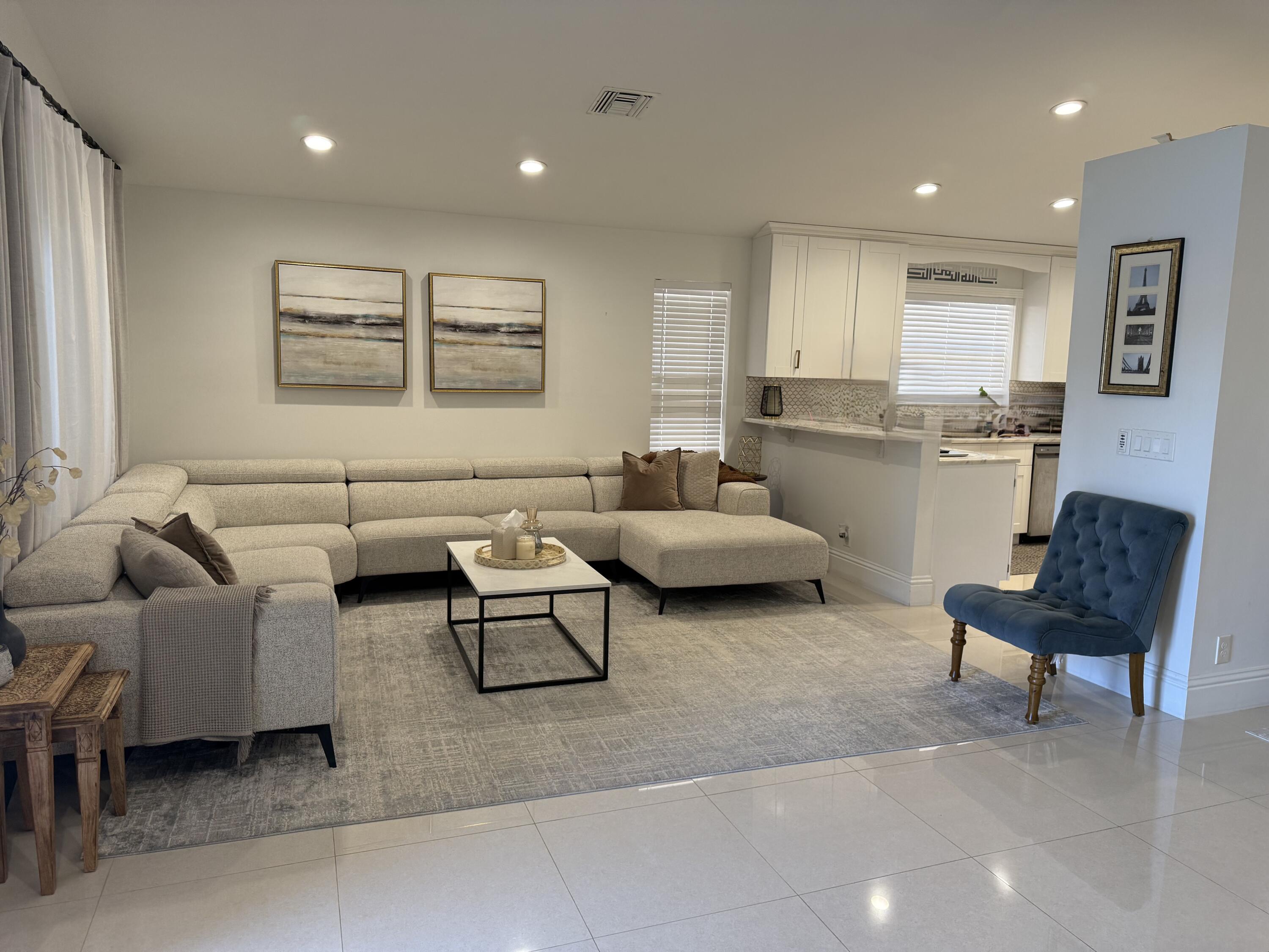 5325 Bodega Place Delray Beach, FL 33484 - Photo 13 of 40 a living room with furniture and a large window