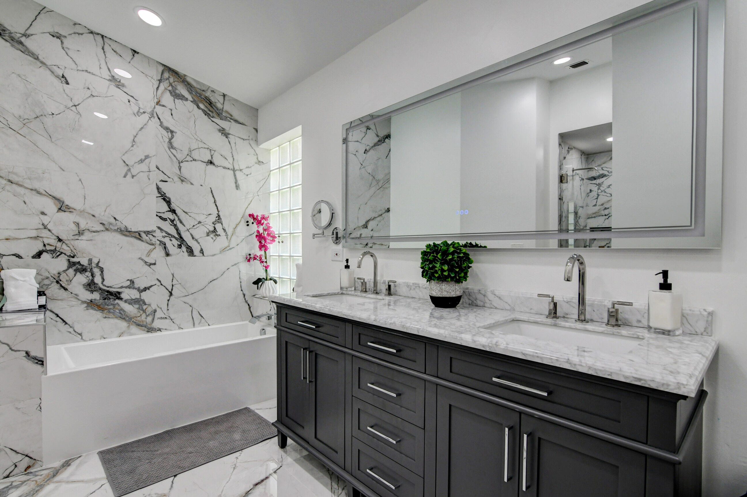 5325 Bodega Place Delray Beach, FL 33484 - Photo 16 of 40 a bathroom with a granite countertop sink a mirror and a bathtub