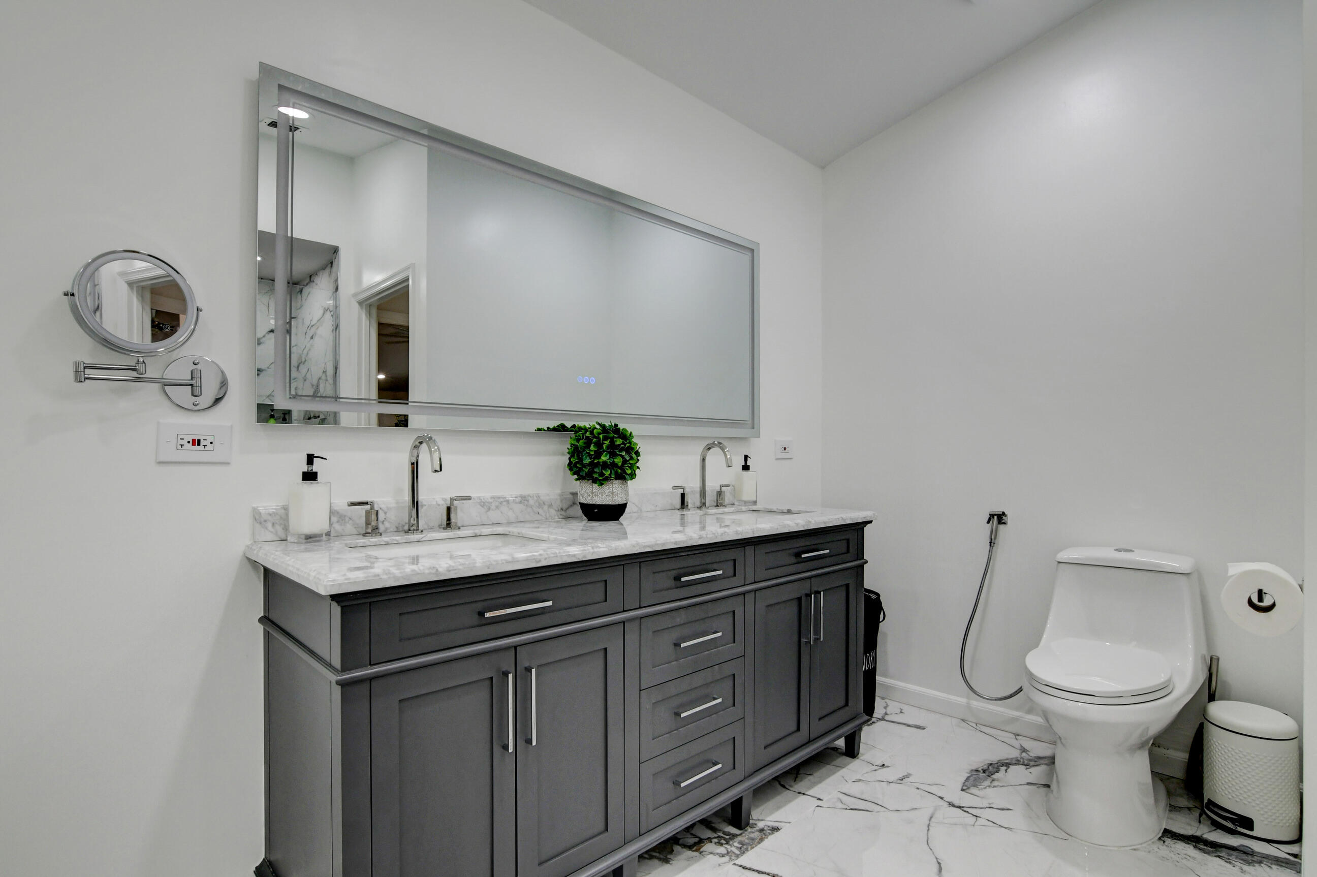 5325 Bodega Place Delray Beach, FL 33484 - Photo 17 of 40 a bathroom with a toilet sink and mirror