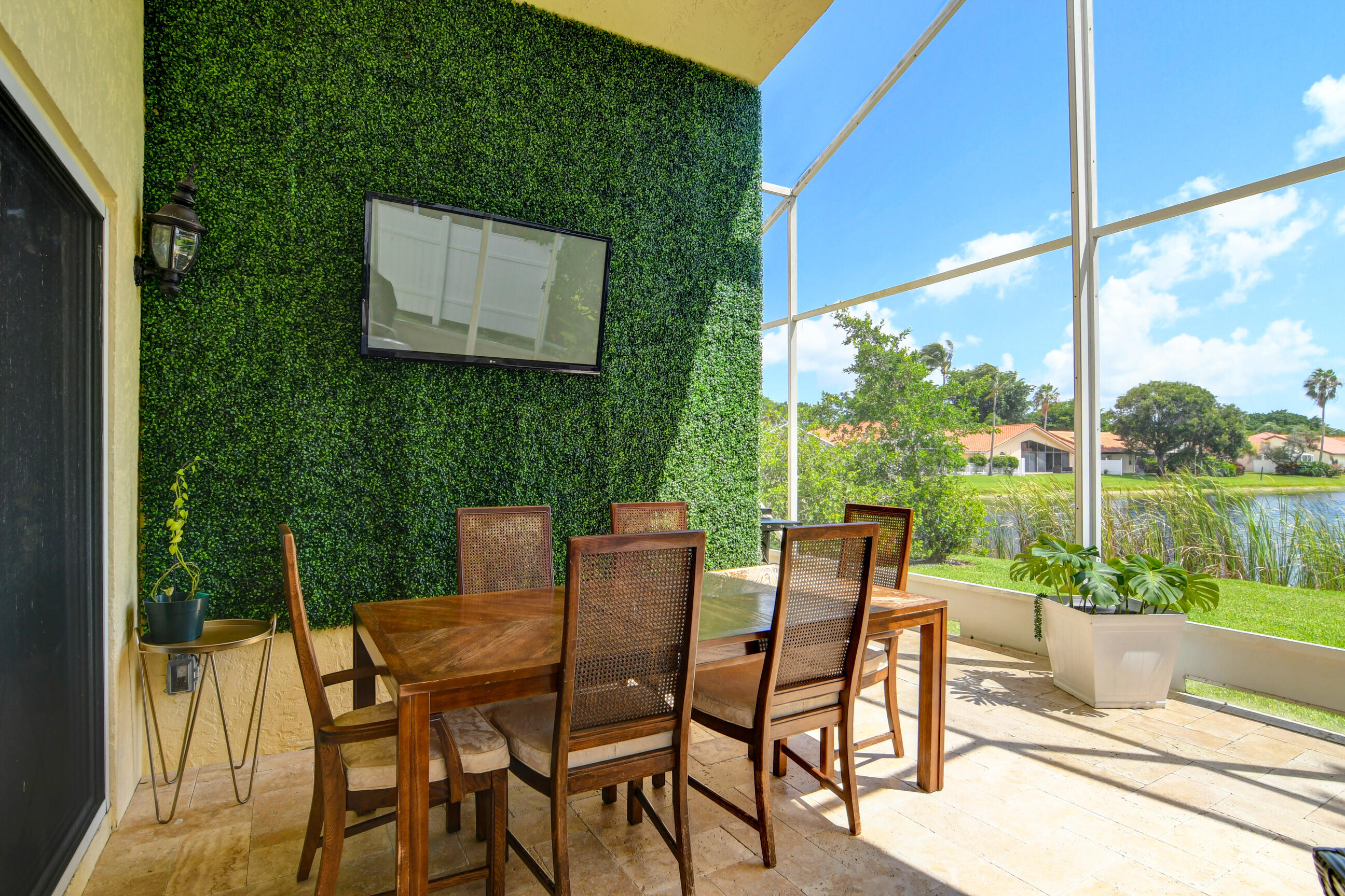 5325 Bodega Place Delray Beach, FL 33484 - Photo 27 of 40 a view of a patio with a table chairs and a backyard
