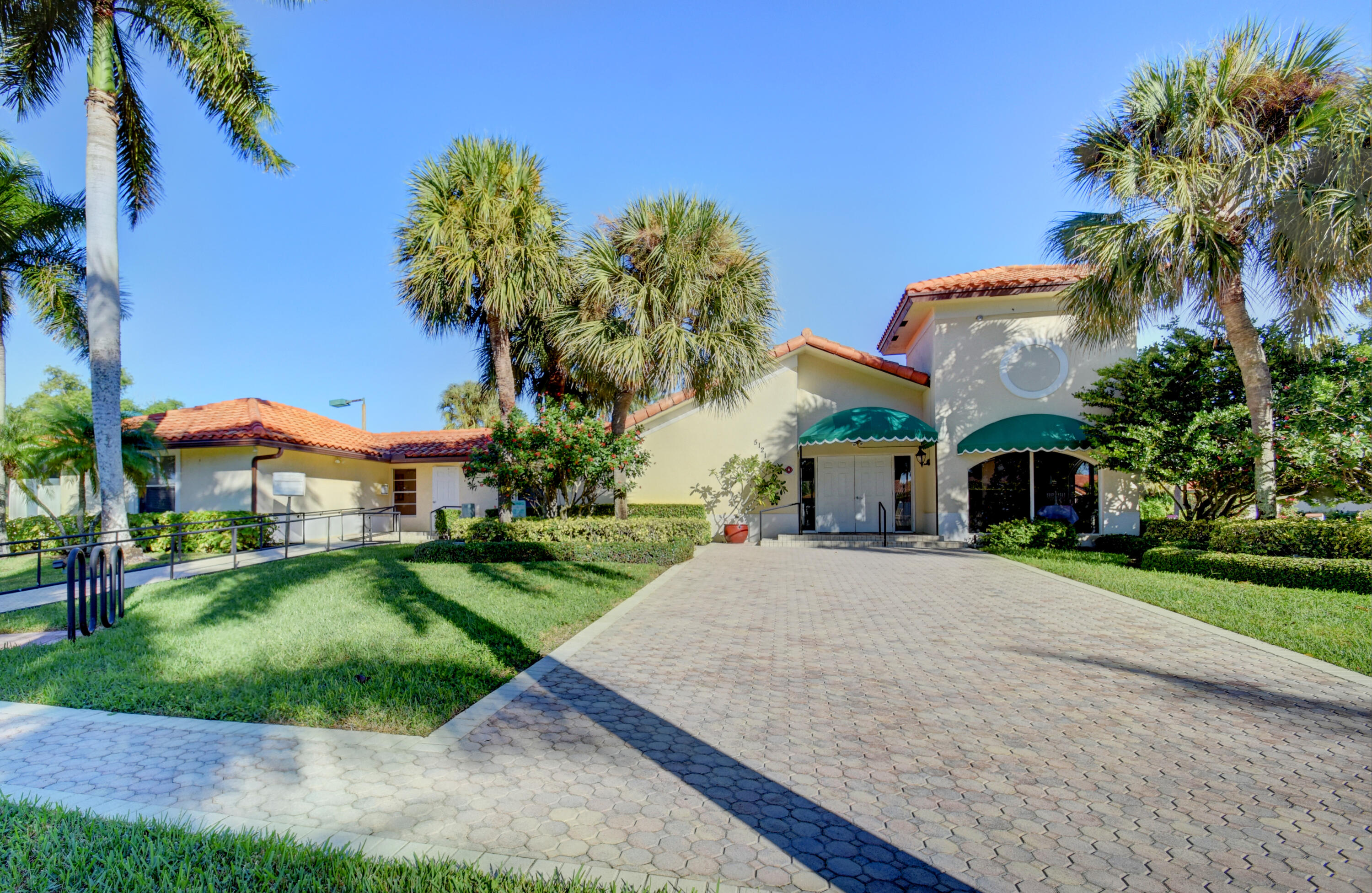 5325 Bodega Place Delray Beach, FL 33484 - Photo 34 of 40 a front view of a house with a yard and garage