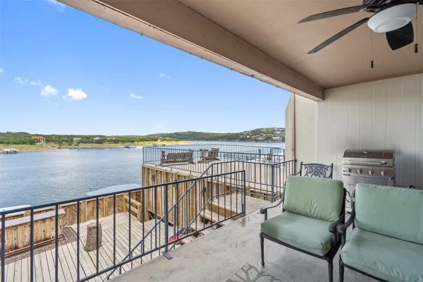 a balcony with furniture and city view