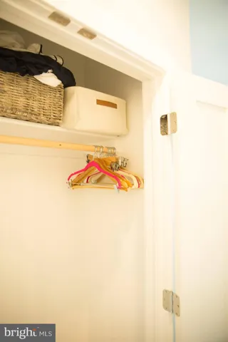 swimming pool view with a seating space