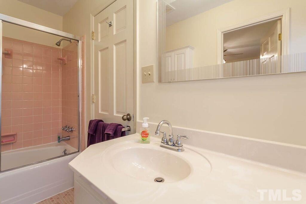 2903 Buckingham Road Durham, NC 27707 - Photo 11 of 15 a bathroom with a tub sink and mirror