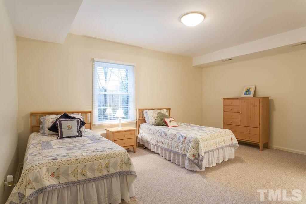 2903 Buckingham Road Durham, NC 27707 - Photo 13 of 15 a bedroom with two beds and painting on the wall