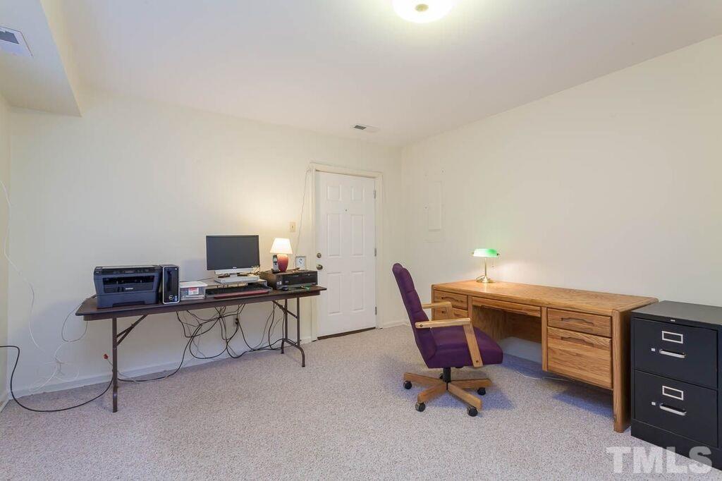 2903 Buckingham Road Durham, NC 27707 - Photo 15 of 15 a workspace with furniture and a wooden floor