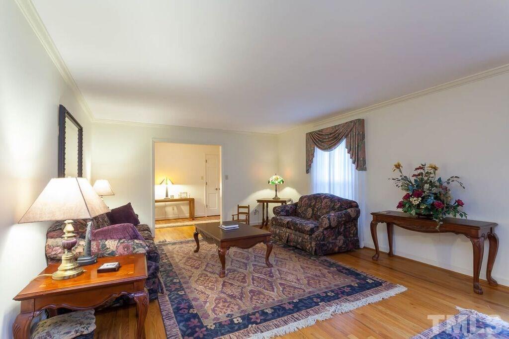 2903 Buckingham Road Durham, NC 27707 - Photo 3 of 15 a living room with furniture and a lamp