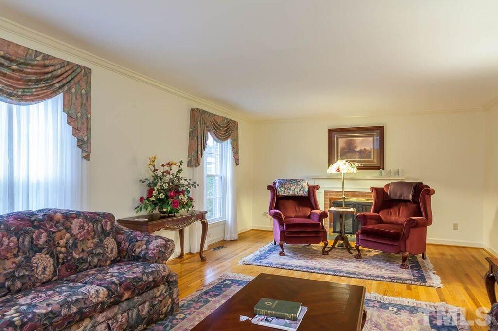 2903 Buckingham Road Durham, NC 27707 - Photo 4 of 15 a living room with furniture and wooden floor